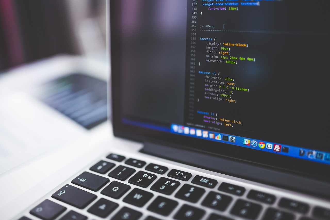 A laptop screen showing source code in a code editor